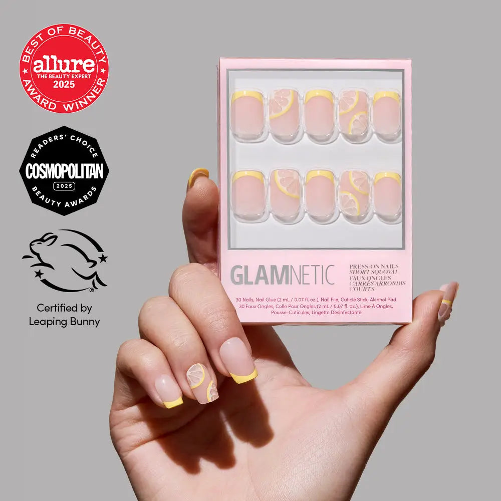 Glamnetic Limonata press-on nails with yellow French tips, short squoval shape, and glossy finish on a white background.