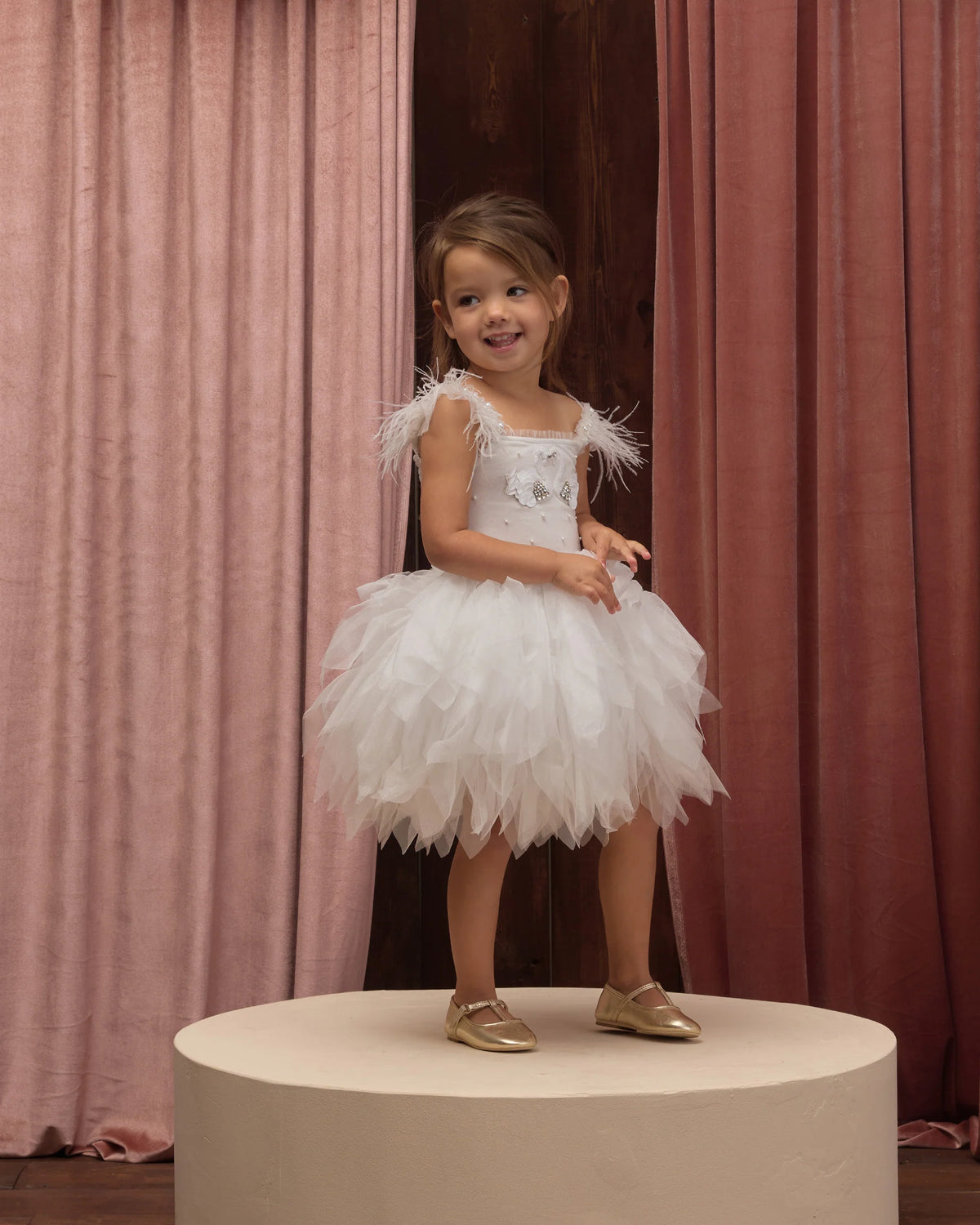 White Magique dress by Noralee, featuring elegant fabric and a flattering silhouette, shown on a model with a simple background.