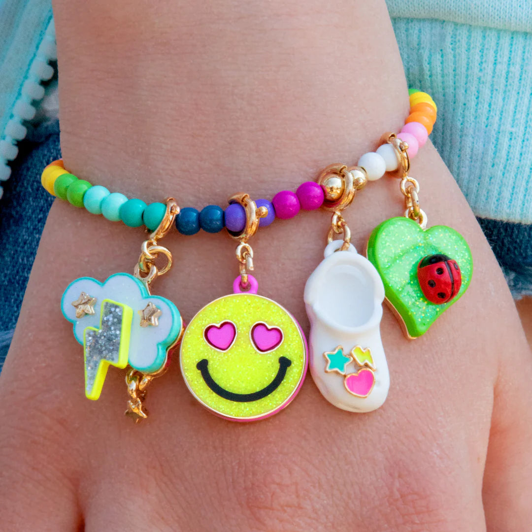 Gold glitter Smiley Face charm from Charm It! featuring a shiny, sparkly smiley face design on a small jewelry charm.