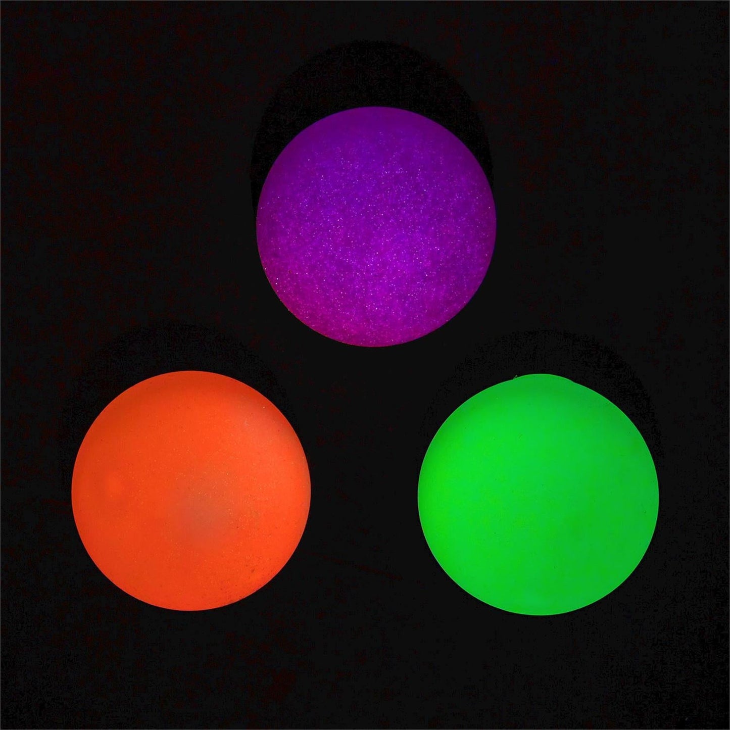 Glow in the Dark Blob Ball by Twos Company, soft and stretchy toy with glowing, translucent slime-like texture in a playful shape.