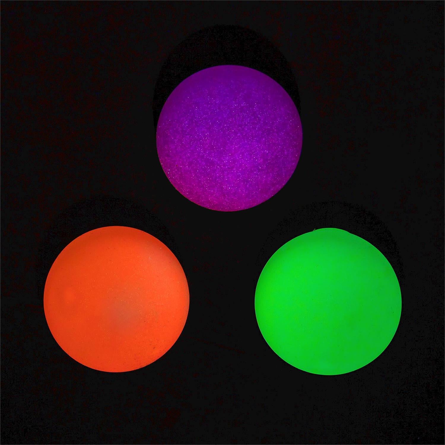 Glow in the Dark Blob Ball by Twos Company, soft and stretchy toy with glowing, translucent slime-like texture in a playful shape.