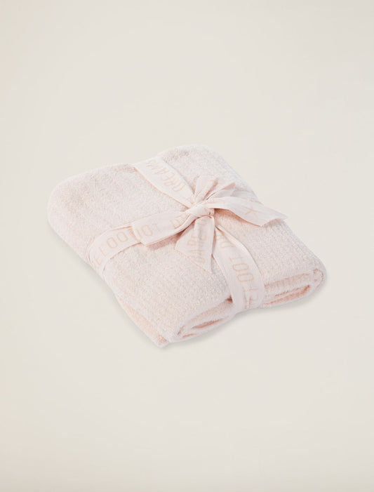 Pink Barefoot Dreams Cozychic Lite ribbed baby blanket with soft, cozy fabric and textured ribbed pattern.