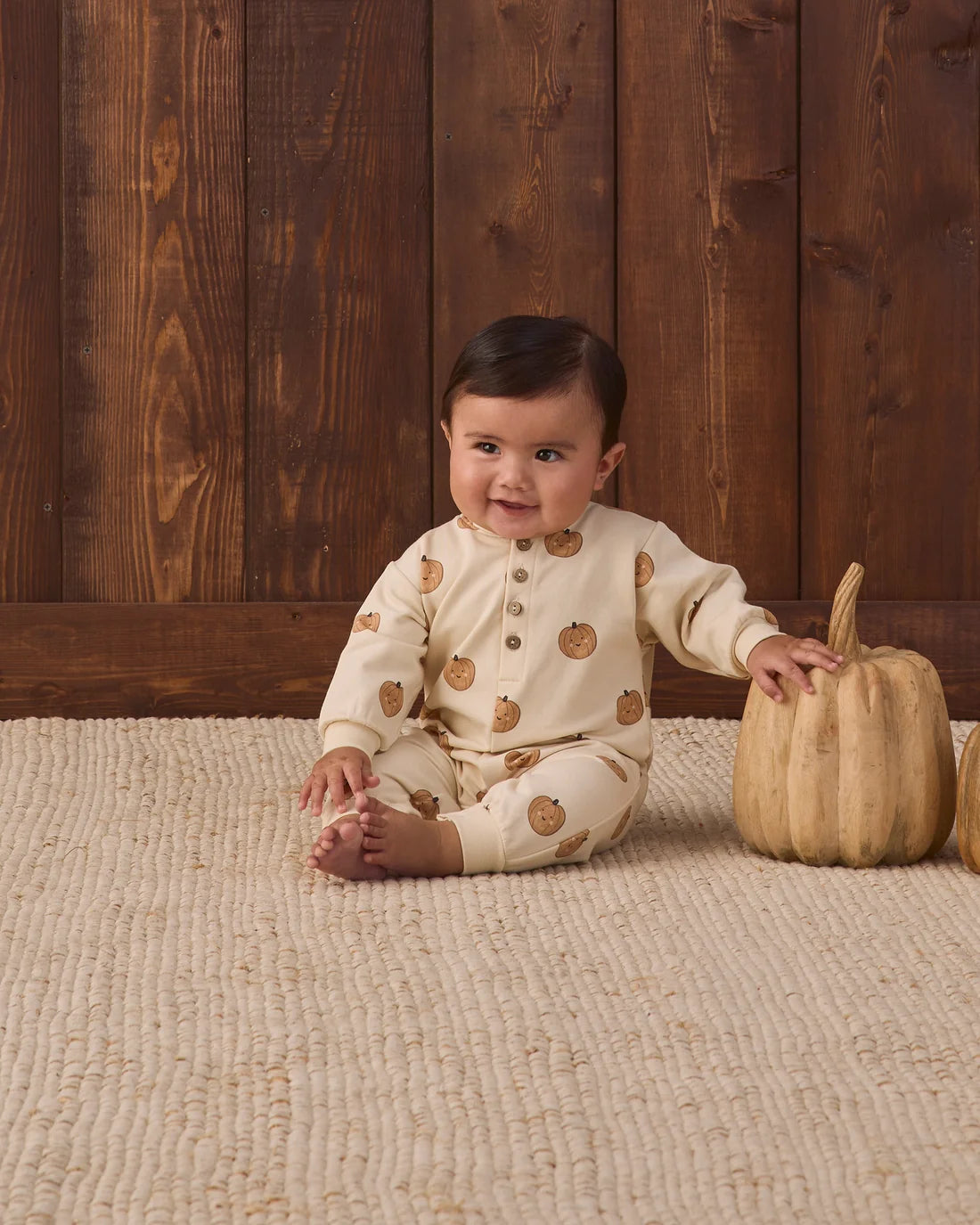 Quincy Mae pumpkins relaxed fleece jumpsuit featuring a cozy pumpkin print and soft fabric, perfect for comfortable casual wear.