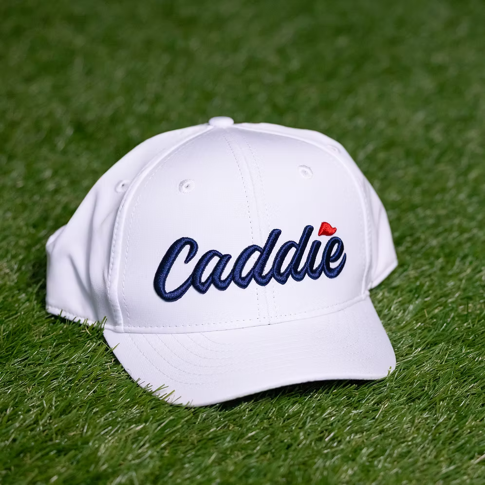 Youth performance cap by Caddie featuring a sporty design, adjustable strap, and lightweight breathable fabric.