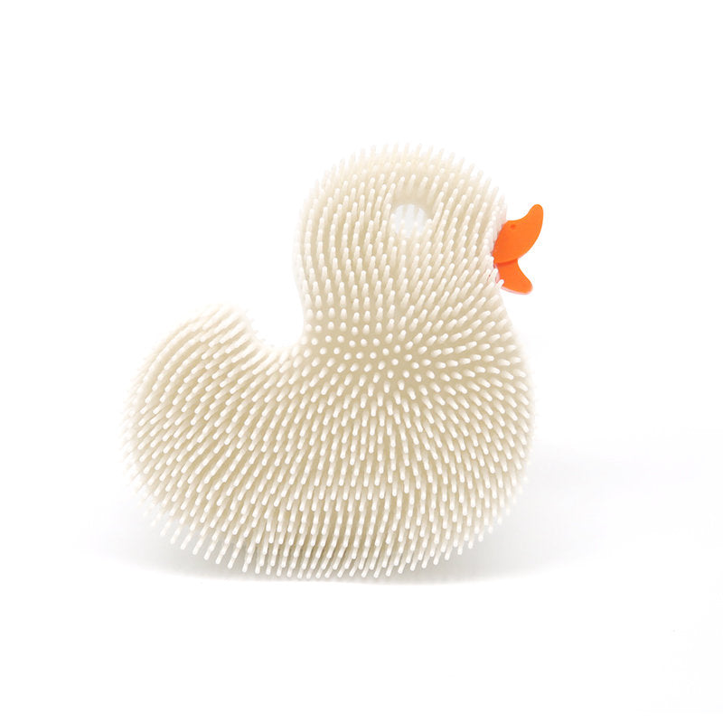 Squigee Duck silicone body scrub toy for babies by New People, featuring a yellow duck shape and soft silicone texture.