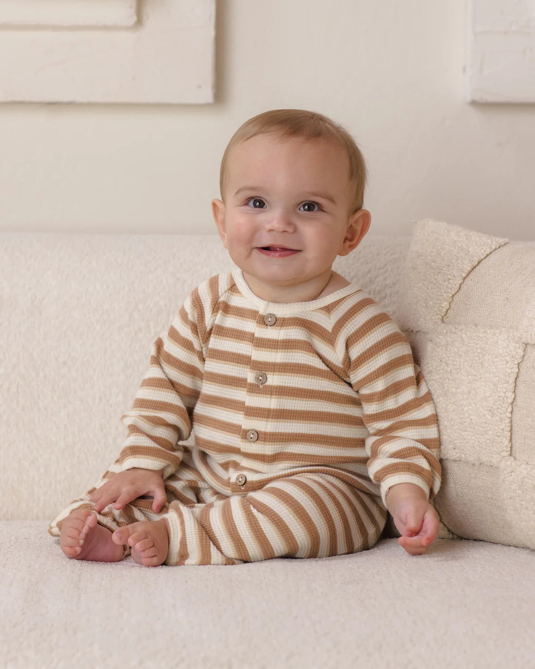 Quincy Mae Spice Stripe waffle long sleeve jumpsuit for babies, featuring a cozy, striped waffle fabric and long sleeves.
