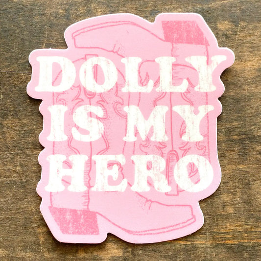 Dolly Is My Hero sticker by Southern Fried Design Barn featuring bold text and vibrant colors on a clear background.
