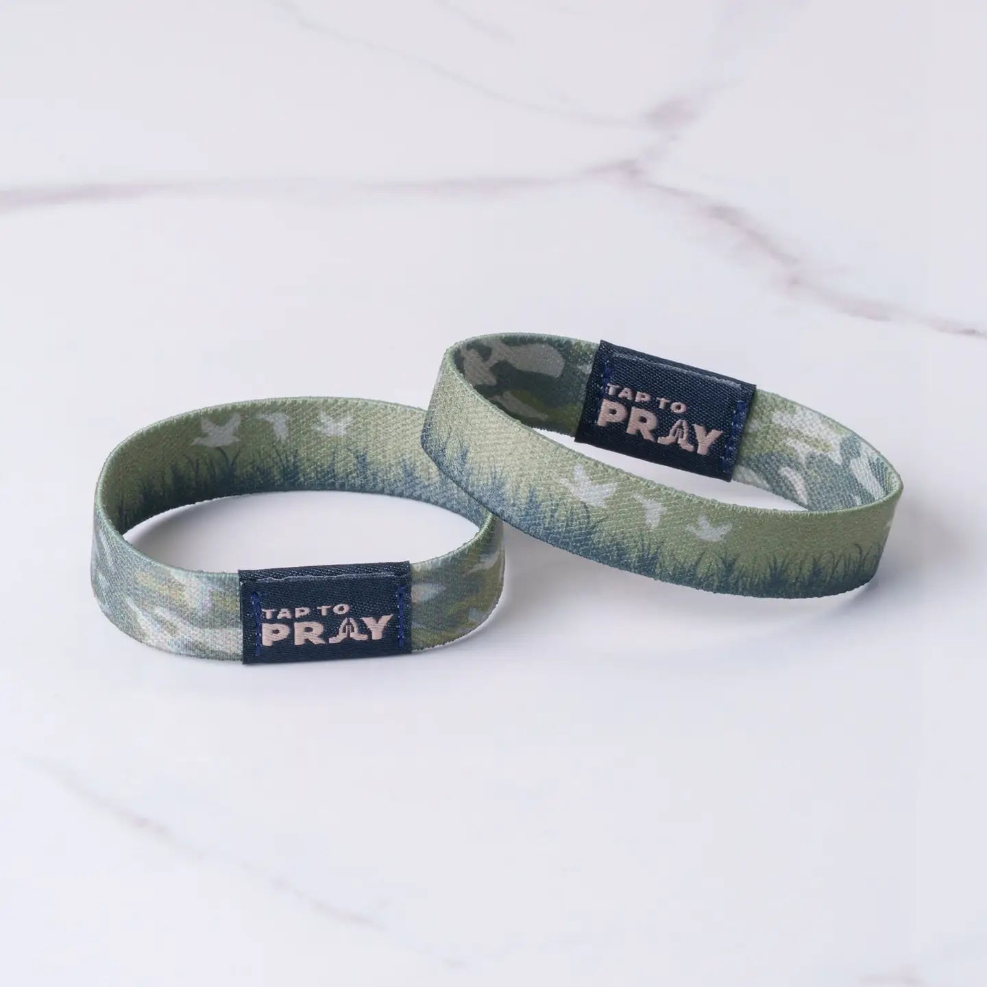 Versible Tap To Pray® wristband featuring waterfowl design, made of durable material, with engraved prayer symbols on the band.
