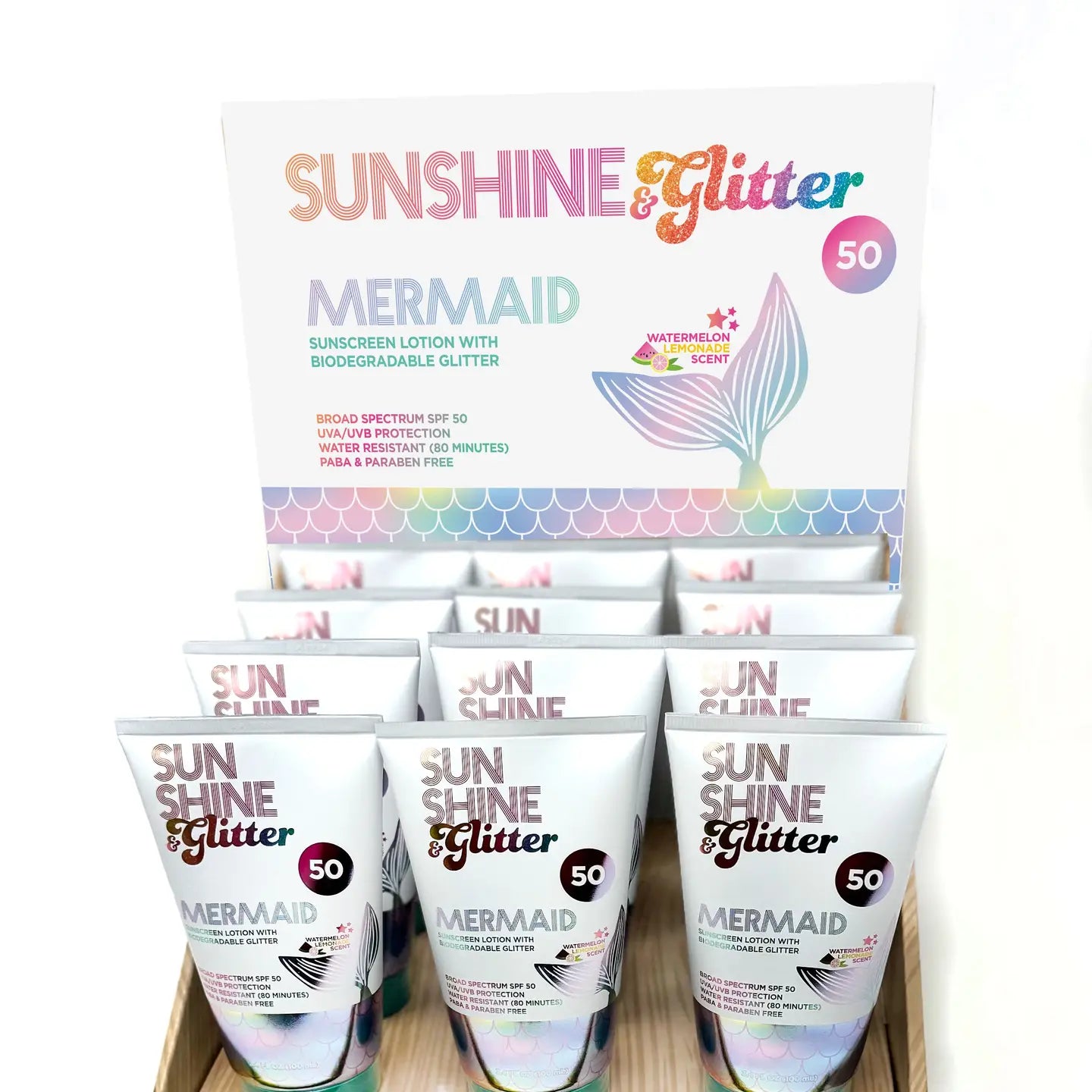 Sunshine & Glitter Mermaid Sunscreen Lotion with Glitter, showing the colorful packaging and a hint of the glittery formula inside.