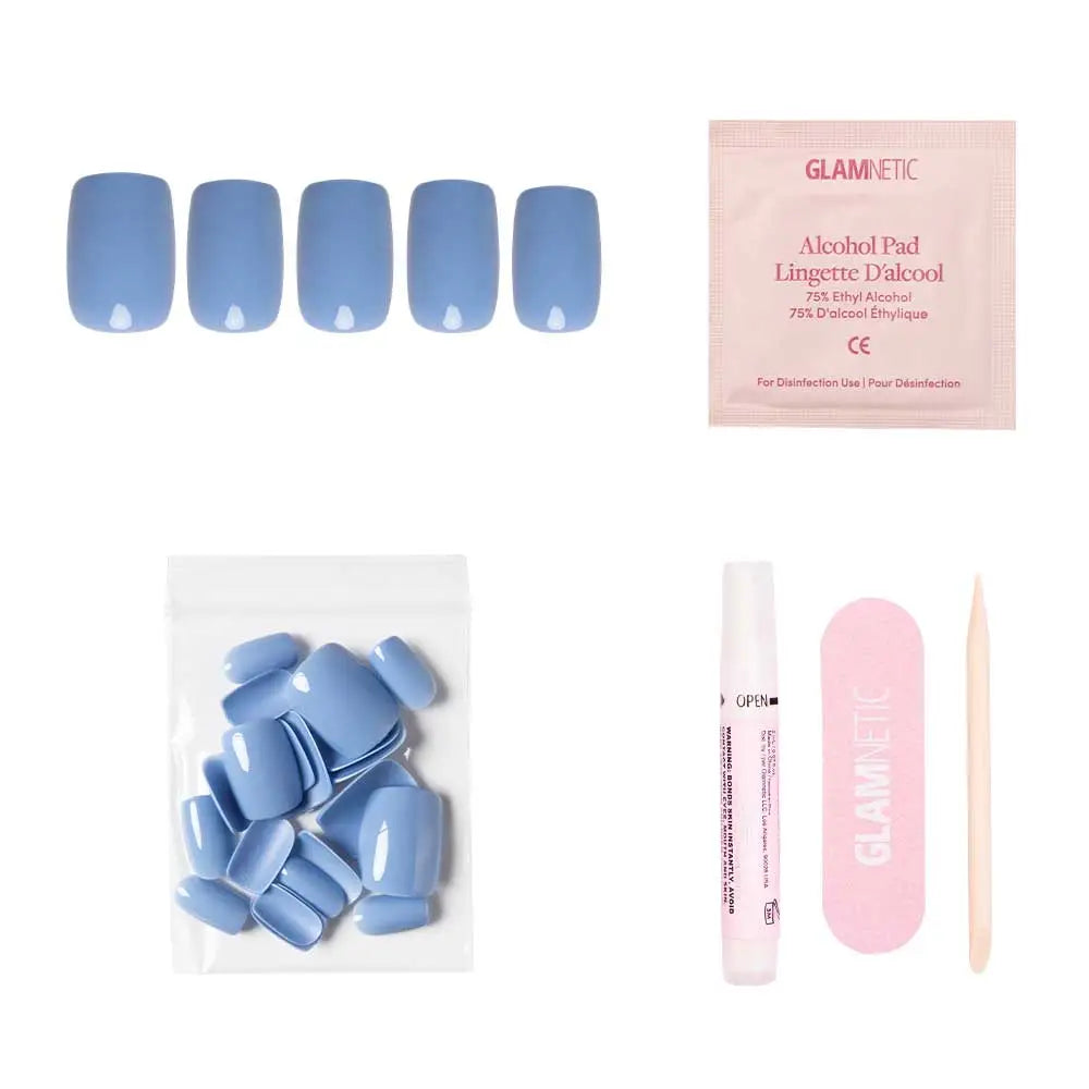 Blue cashmere press-on nails by Glamnetic, showcasing elegant, smooth finish and natural shape on a neutral background.