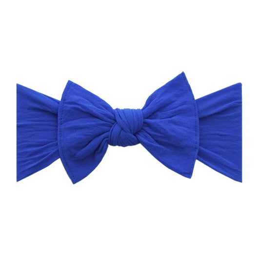 Royal blue original knot soft nylon headband by Baby Bling Bows featuring a stylish knot design and comfortable fit for babies.