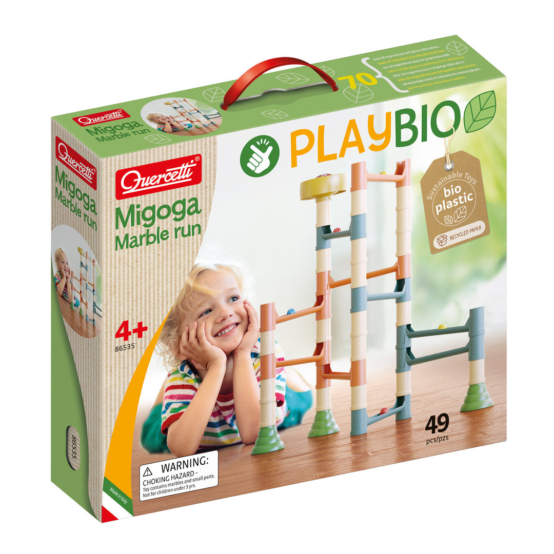 Quercetti Migoga Marble Run with colorful plastic tracks and marble balls, assembled for play on a flat surface.