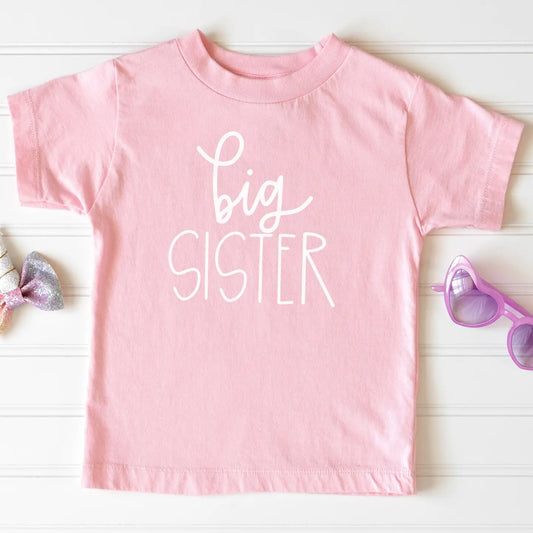 Pink Big Sister T-shirt by Cuddle Sleep Dream featuring bold "Big Sister" text on soft cotton fabric.