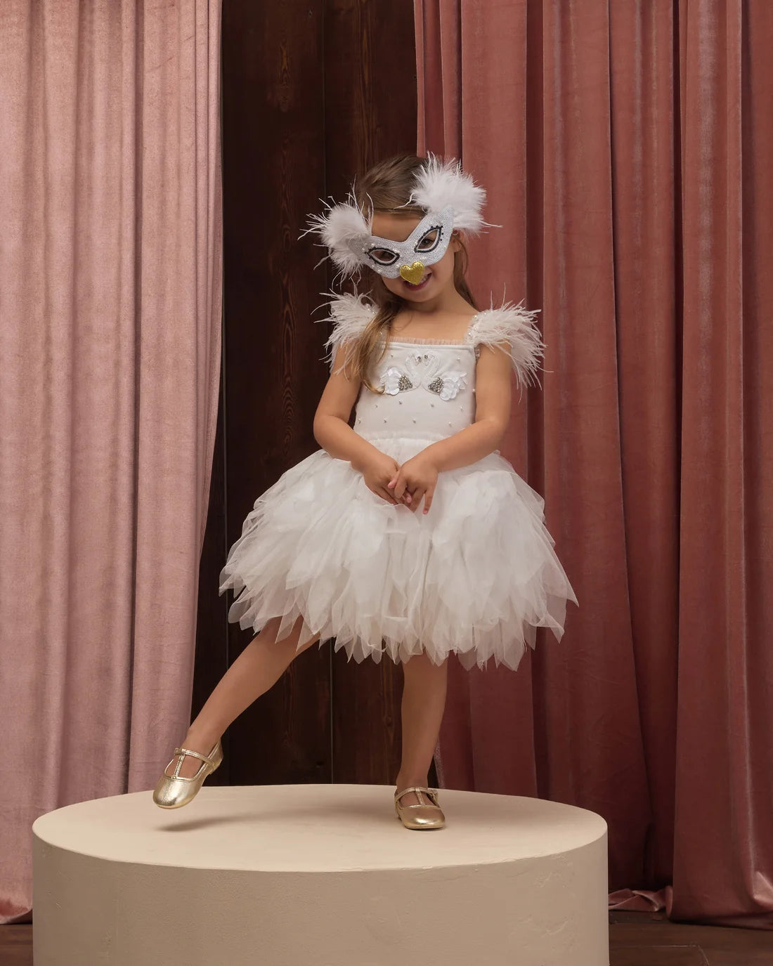 Ivory Swan Mask by Noralee featuring elegant feathers and intricate detailing for costume or decorative use