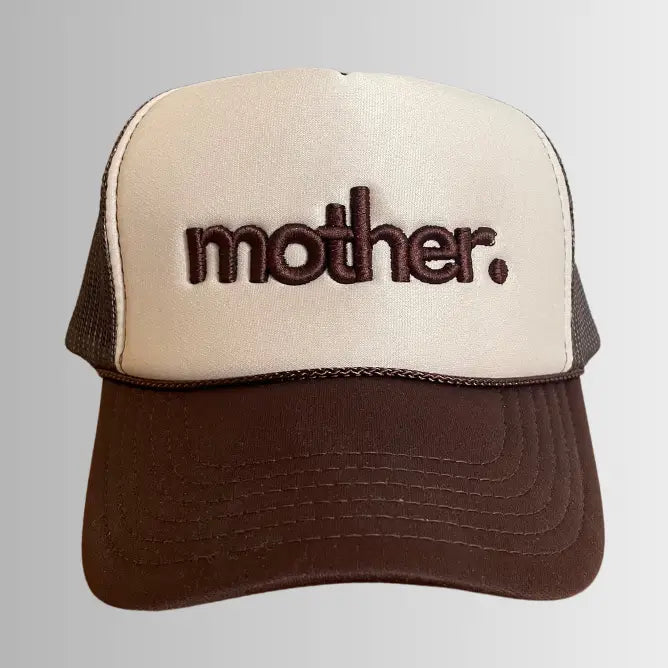 Mother embroidered trucker hat in brown and tan with mesh back and curved brim, featuring a stylish embroidered "Mother" logo.