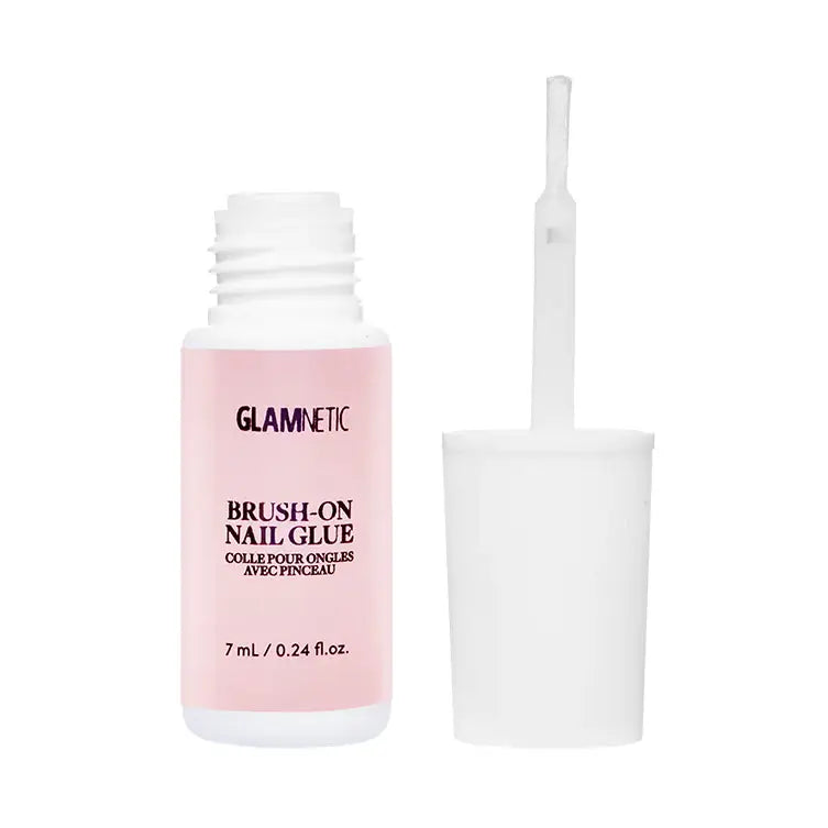 Glamnetic brush-on nail glue bottle with applicator brush for quick, strong adhesion of artificial nails.