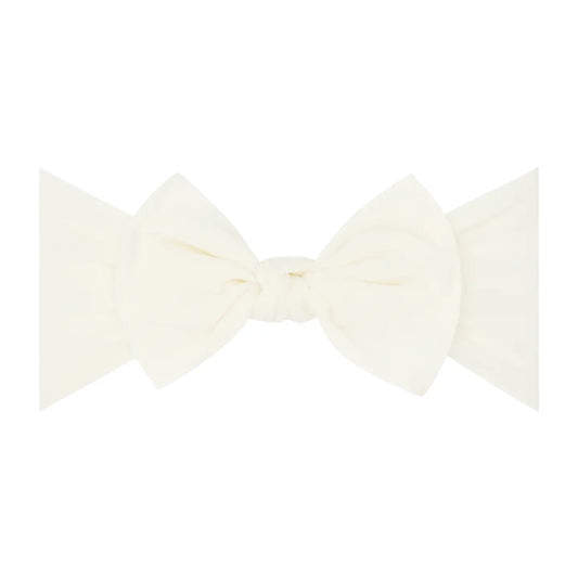 Ivory Baby Bling Bows nylon headband with soft knot design for infants and toddlers, comfortable and stylish hair accessory.