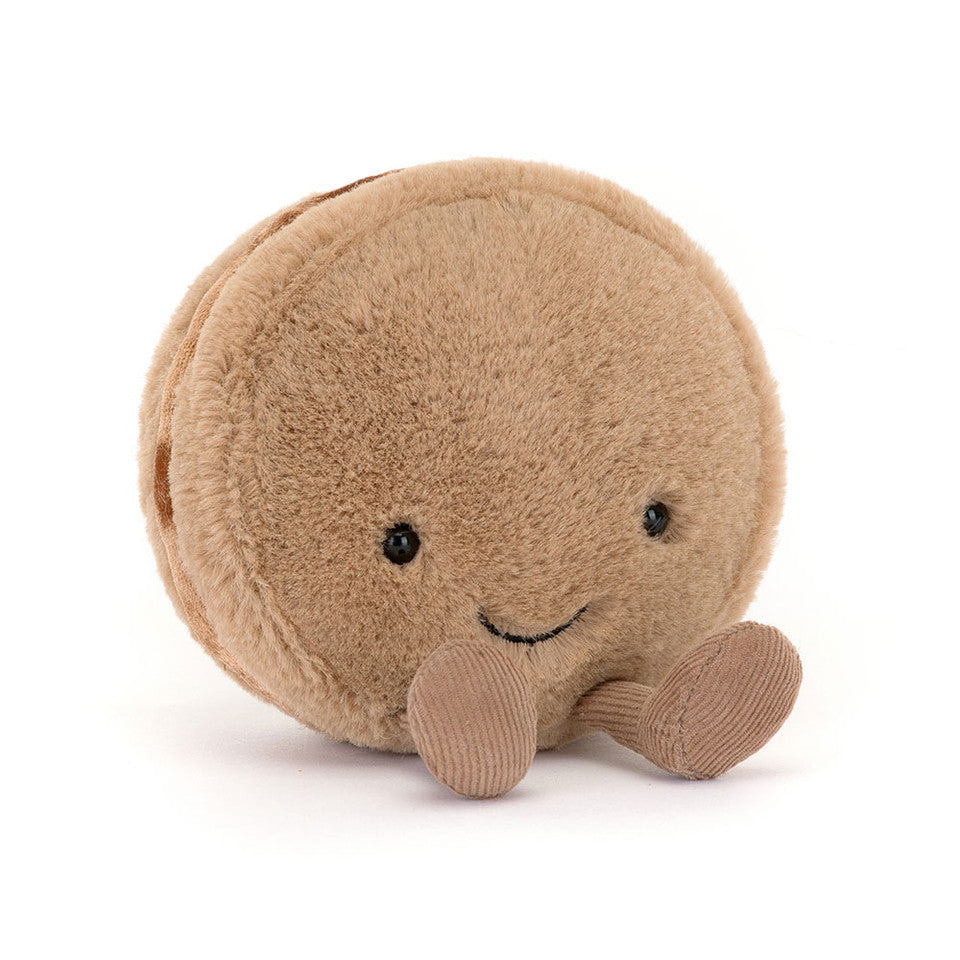 Soft Jellycat Amuseables Mona Macaron plush toy with pink and green accents, featuring a cute, smiling face and whimsical design.
