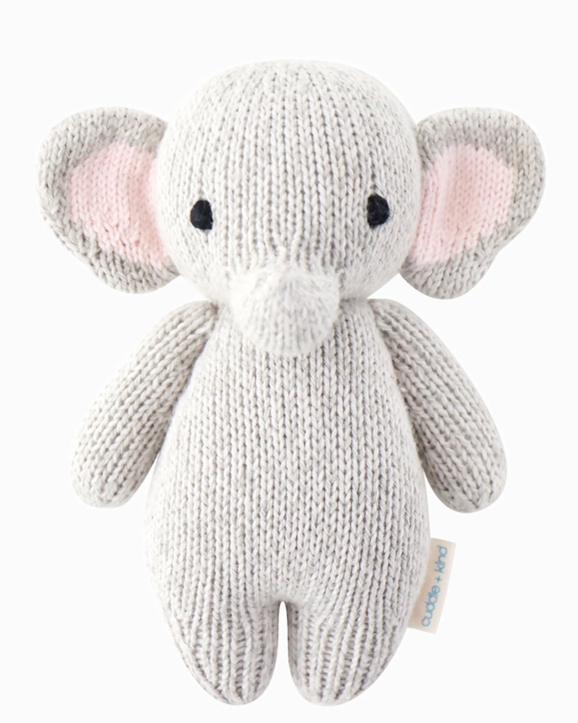 Cuddle + Kind baby elephant plush toy with soft gray fur and large floppy ears, ideal for cuddling and gentle play.