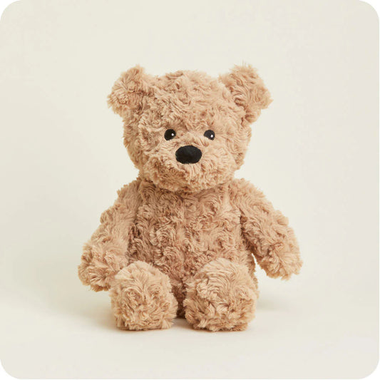 Warmies brown curly bear plush toy with soft fur and detailed facial features, perfect for cuddling and comforting.