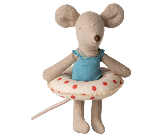 Maileg Little Sister Beach Mouse with float, red dots, dressed for summer, sitting on a beach float in colorful outdoor scene.