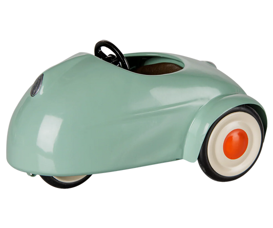 Maileg light mint-colored mouse toy in a car-shaped design, perfect for children's play and imaginative adventures.