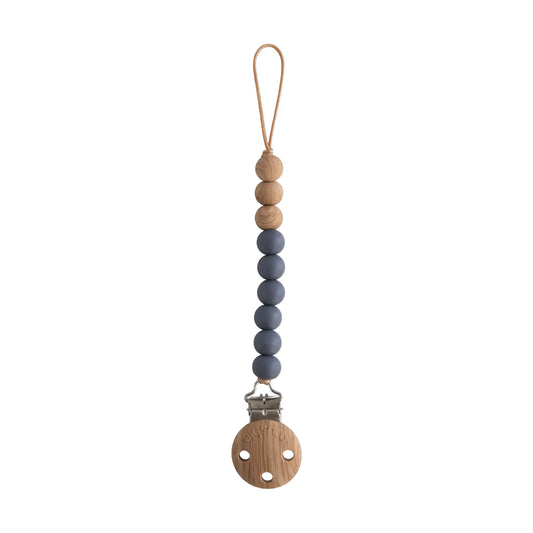 Eva silicone pacifier clip by Mushie, featuring a sleek black iron design with a soft silicone strap for baby accessories.