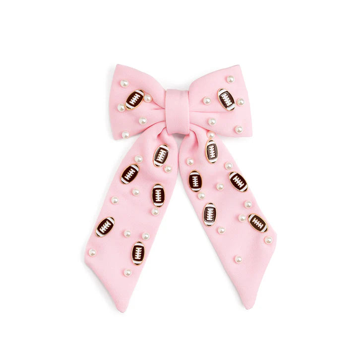 Football-shaped pearl gemstone hair clip by Sweet Wink with a bow design, perfect for stylish hair accessories.