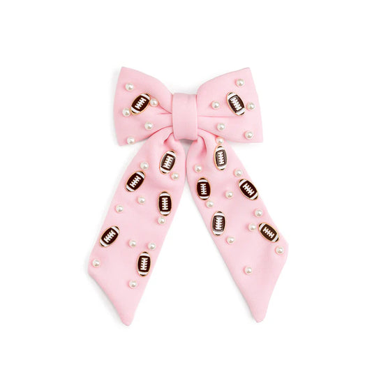 Football-shaped pearl gemstone hair clip by Sweet Wink with a bow design, perfect for stylish hair accessories.