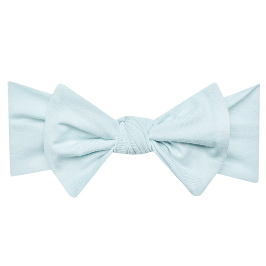 Soft Air Knit Headband with a bow from Sweet E's Children's Boutique, featuring a comfortable stretch and cute bow detail.