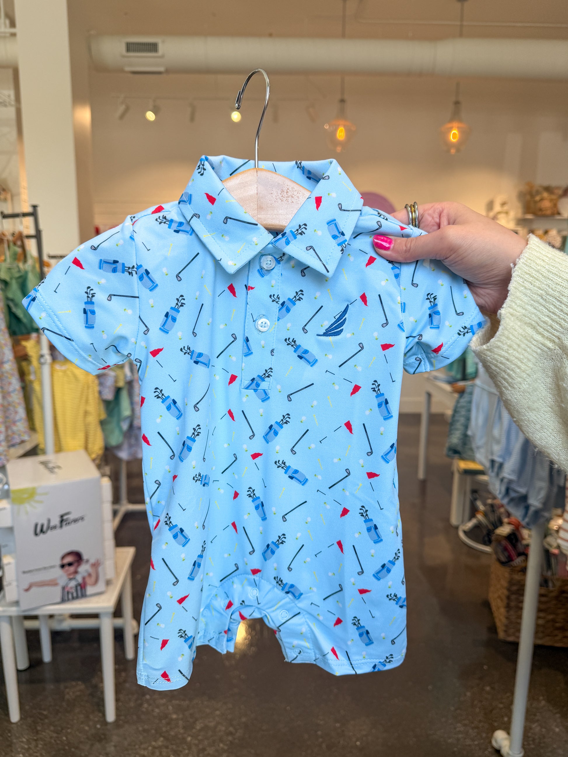 Blue Golf Bag Print Banks Performance Polo Romper by Coolybri, featuring a vibrant golf-themed pattern and casual fit.