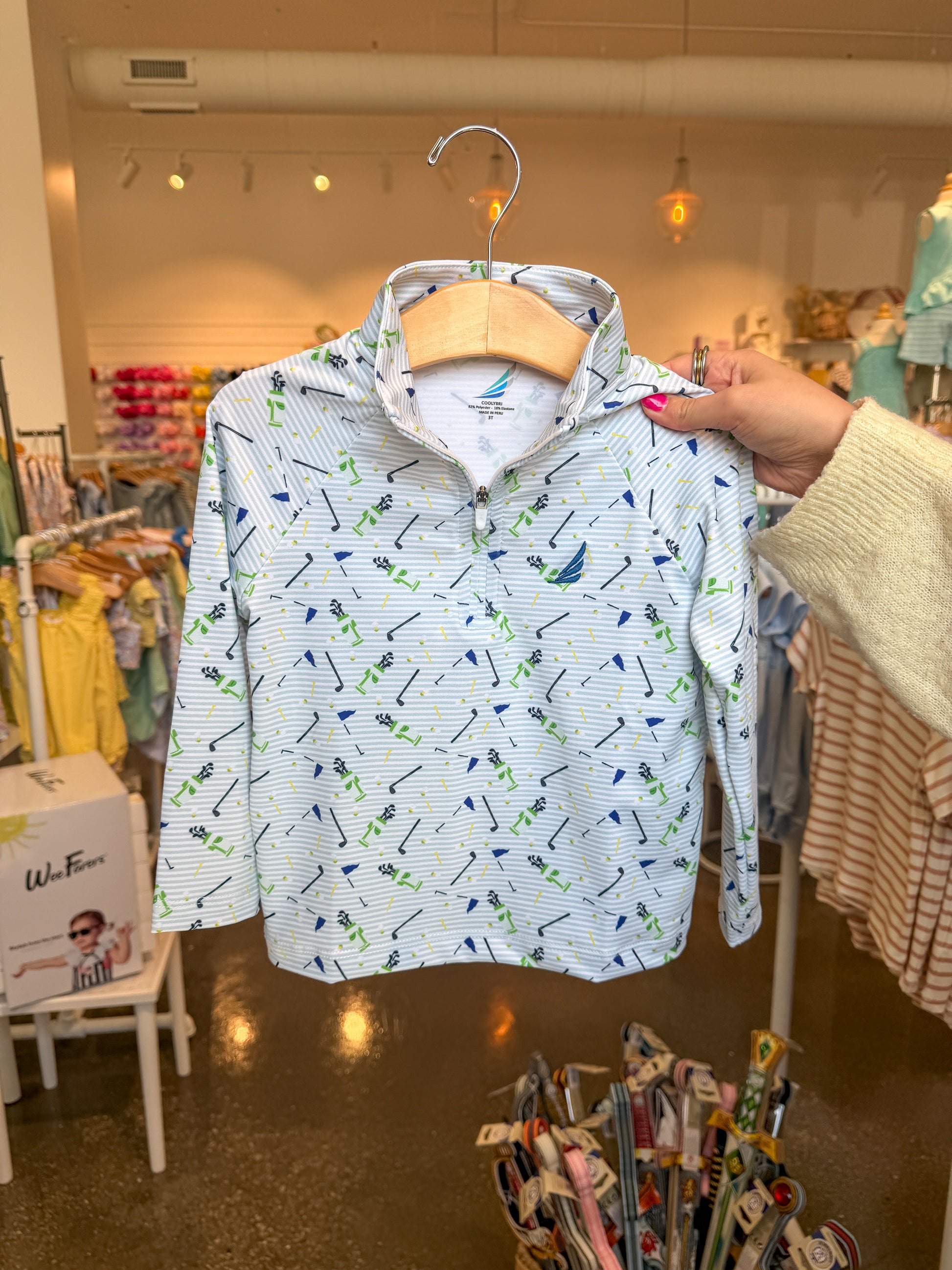 Coolybri Golf Print Levi Performance 1/4 Zip shirt with vibrant golf-themed design, lightweight fabric, and comfortable fit.