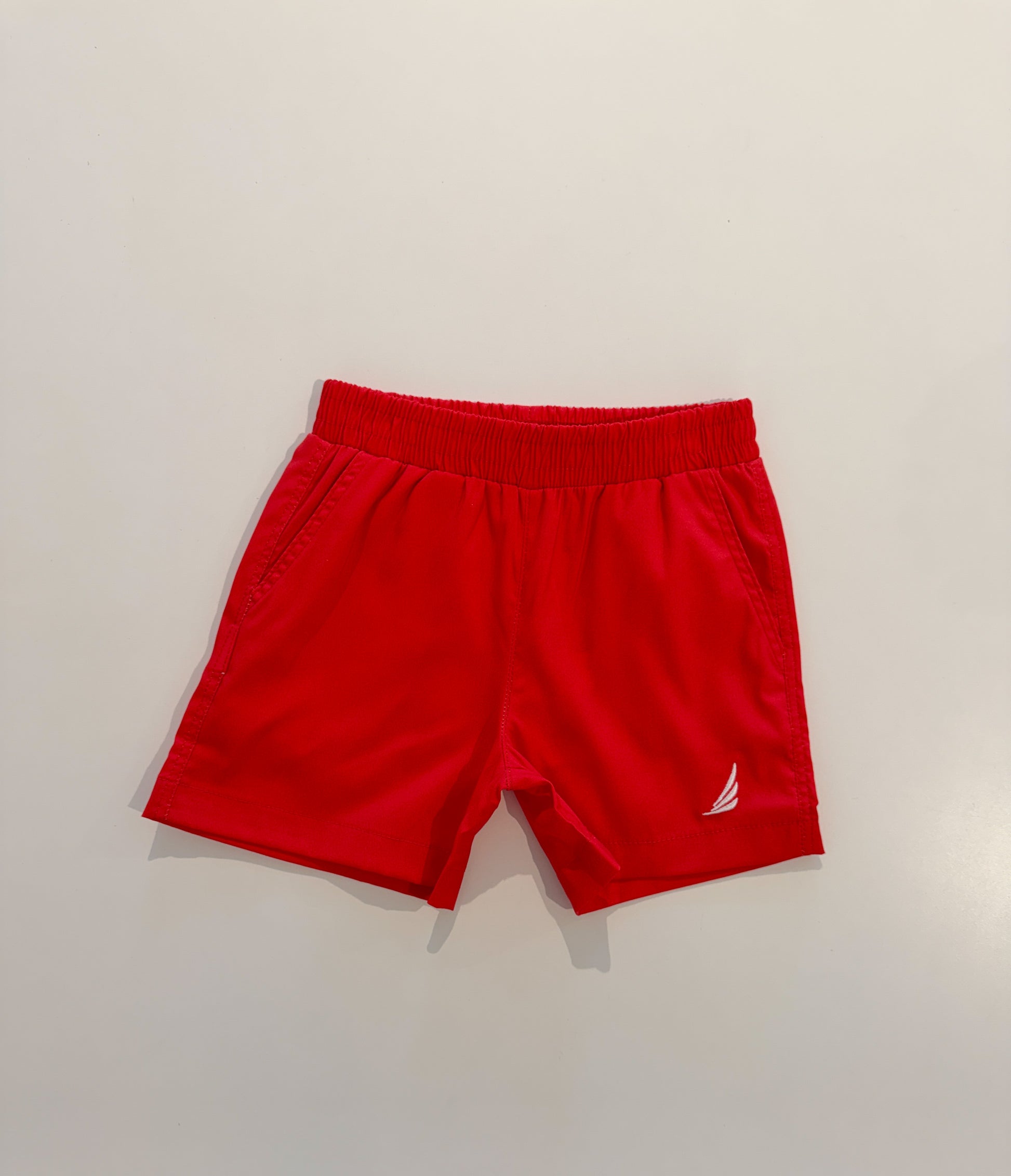 Solid red River Performance short by Coolybri, featuring athletic fit and breathable fabric, shown on a model.