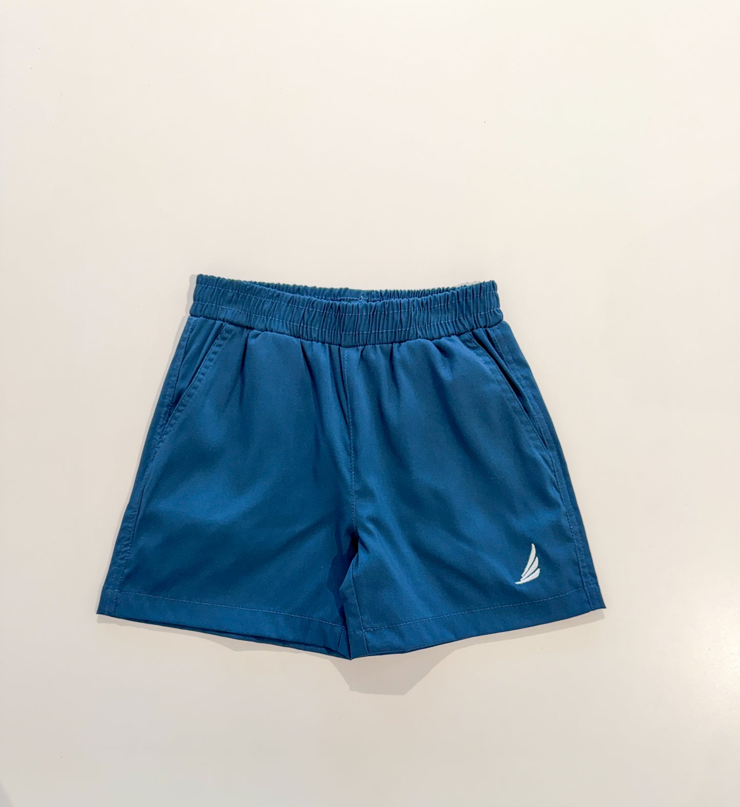 Solid navy River Performance shorts by Coolybri, featuring a comfortable fit and athletic design, shown in a close-up front view.