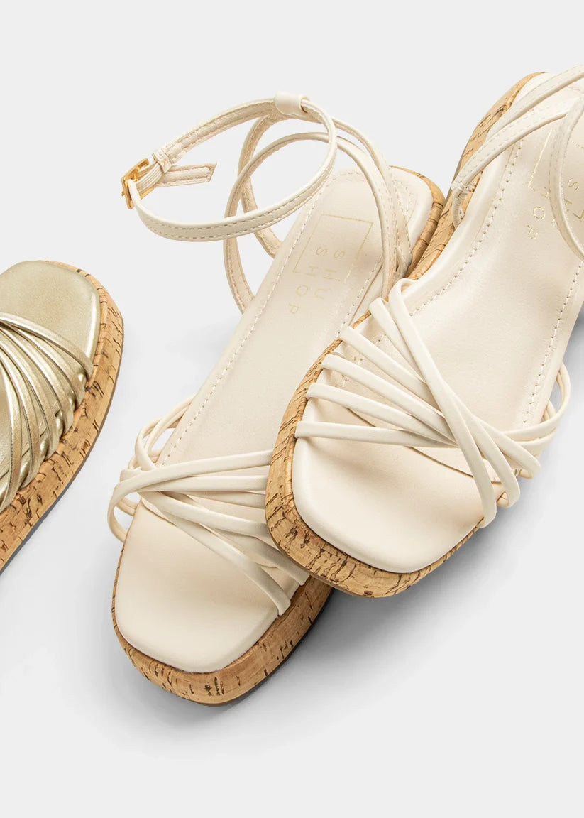 Shushop Bone Isla Mini dog toy in natural bone color, small size with textured surface for chewing and play.