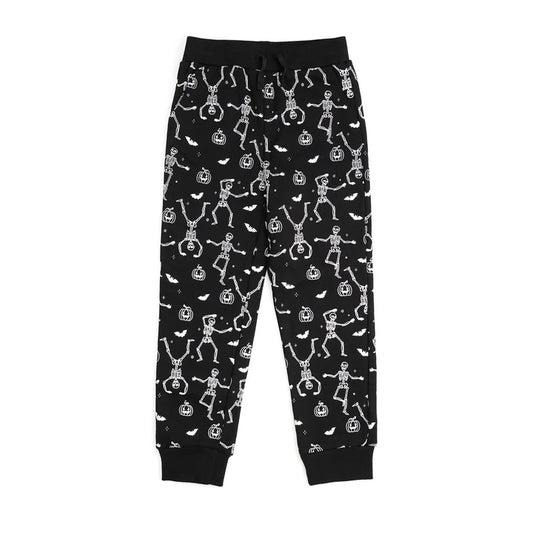 Glow in the dark Silly Skelly Halloween jogger pants by Sweet Wink, featuring spooky skeleton designs on comfortable fabric.