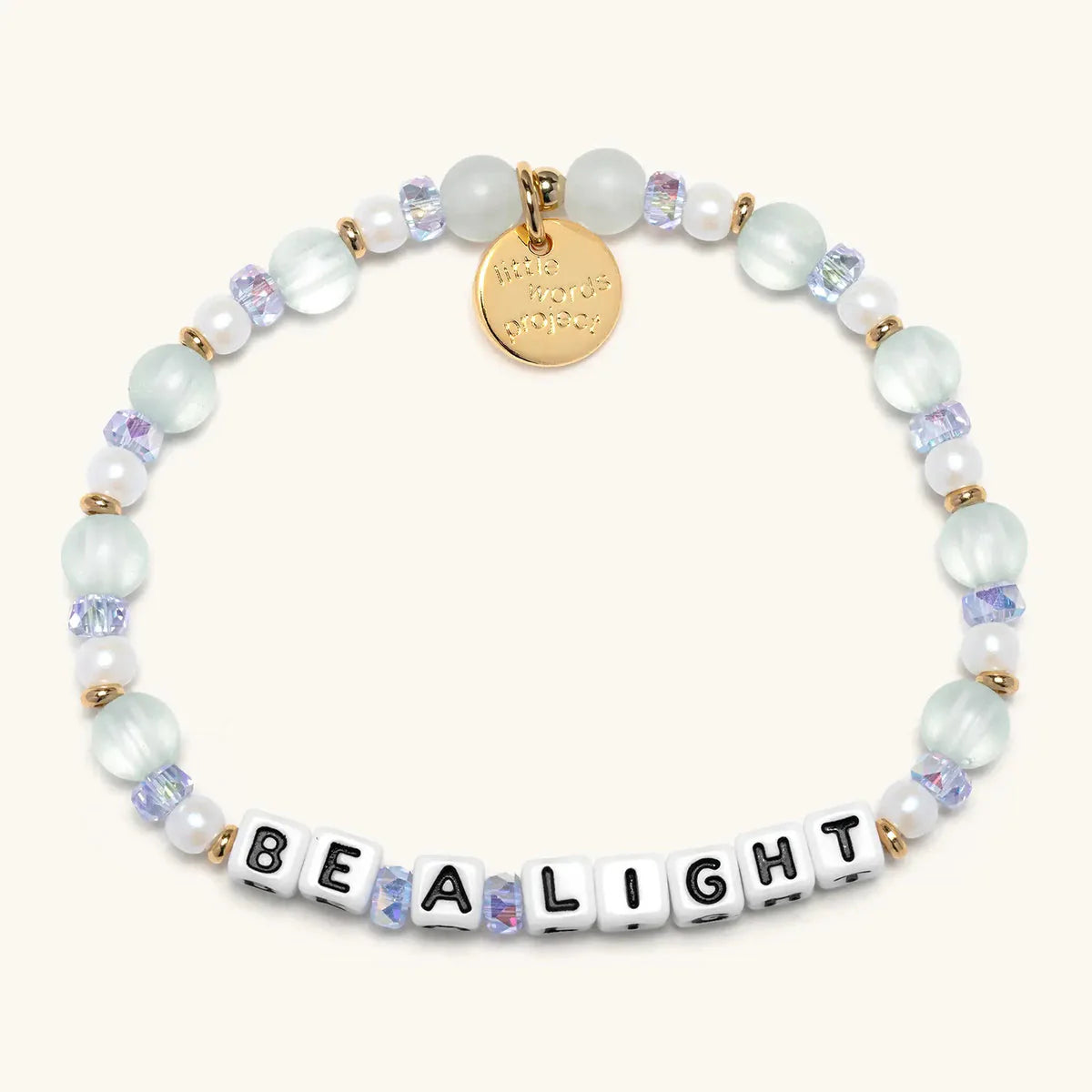 Little Words Project bracelet with "Be A Light" message in honeydew kiss color, featuring a delicate chain and charm.