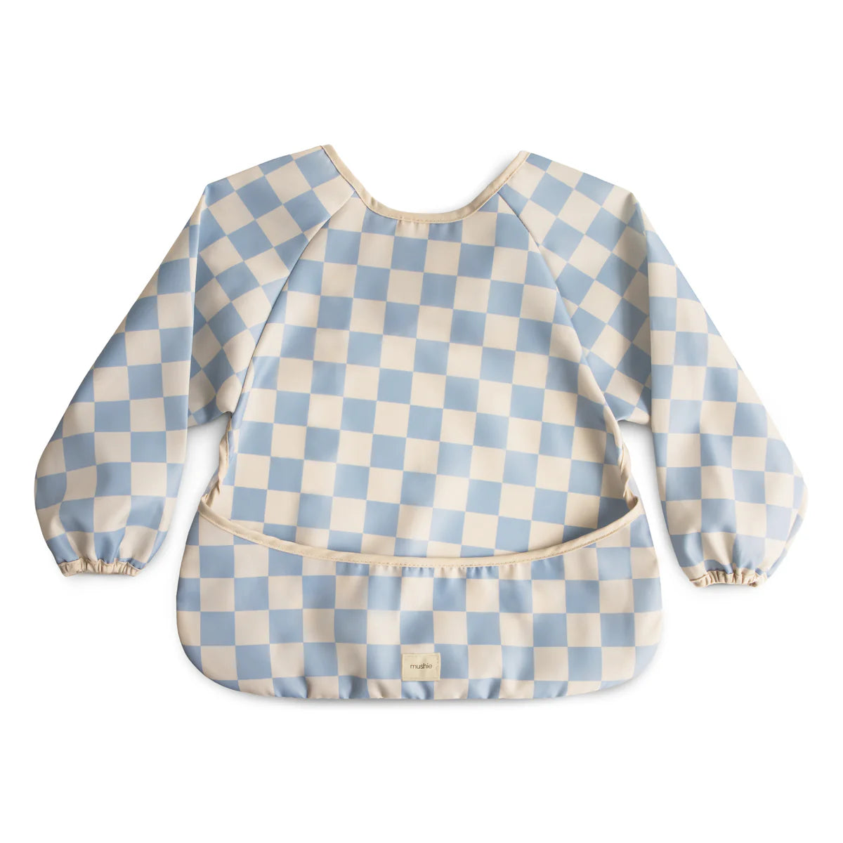 Blue check Mushie long sleeve bib with soft fabric and adjustable neck for babies, designed to protect clothing during meals.