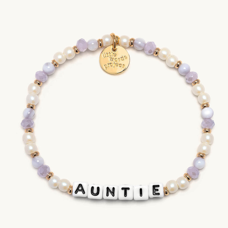 Little Words Project bracelet with engraved word charm, featuring colorful beads and a silver clasp.