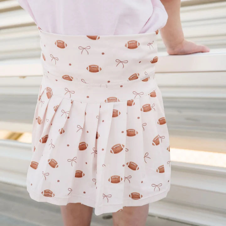 Model wearing Sweet Wink Game Day Athletic Skort, featuring a sporty design with built-in shorts and a comfortable, breathable fabric.