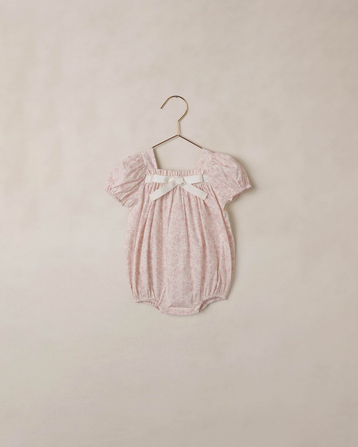 Ivory lavender floral Lyla romper by Noralee, featuring a stylish design with floral pattern and comfortable fit.