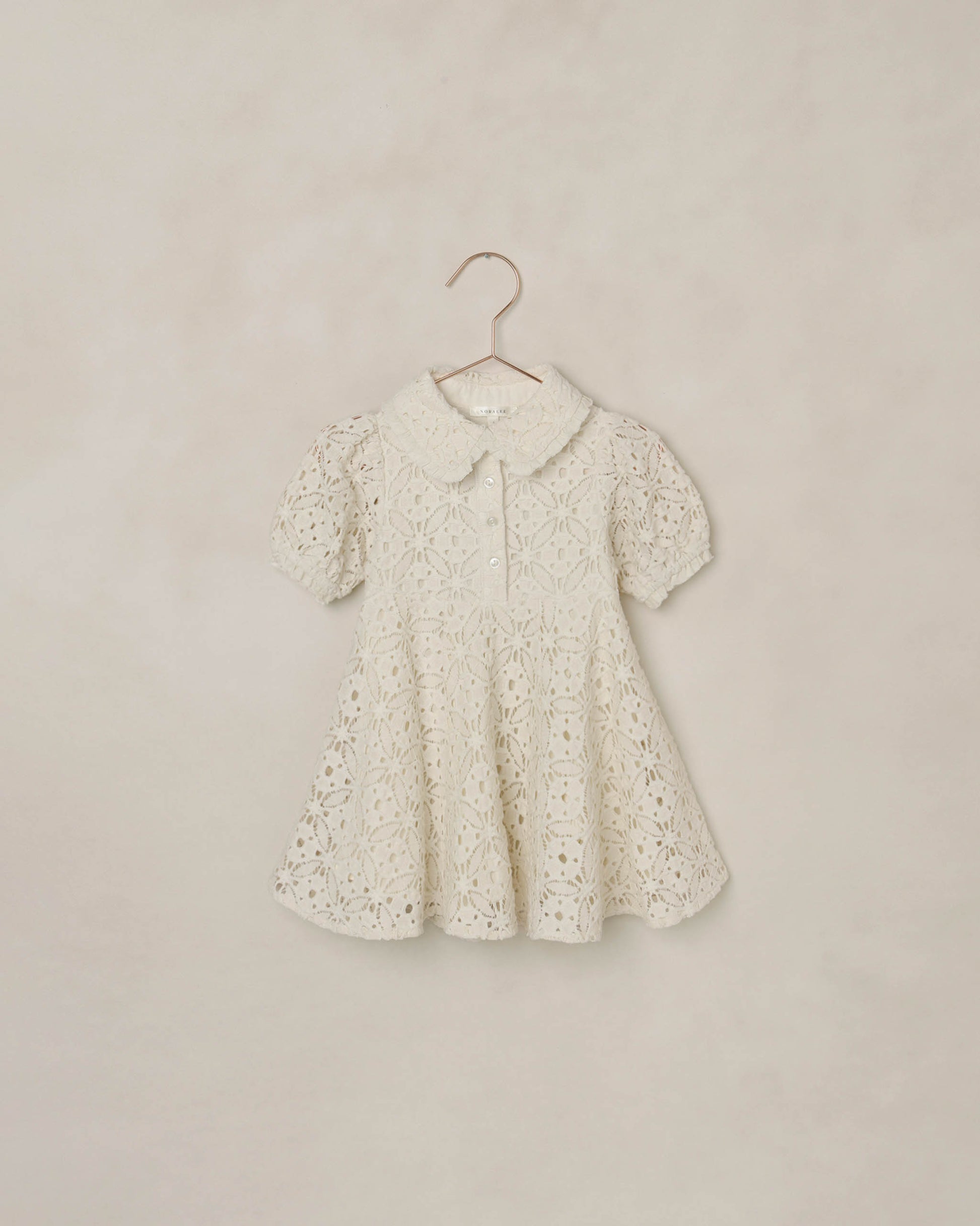 Noralee Eyelet Sara Dress in ivory, featuring eyelet fabric, sleeveless design, and a feminine, lightweight style perfect for summer.