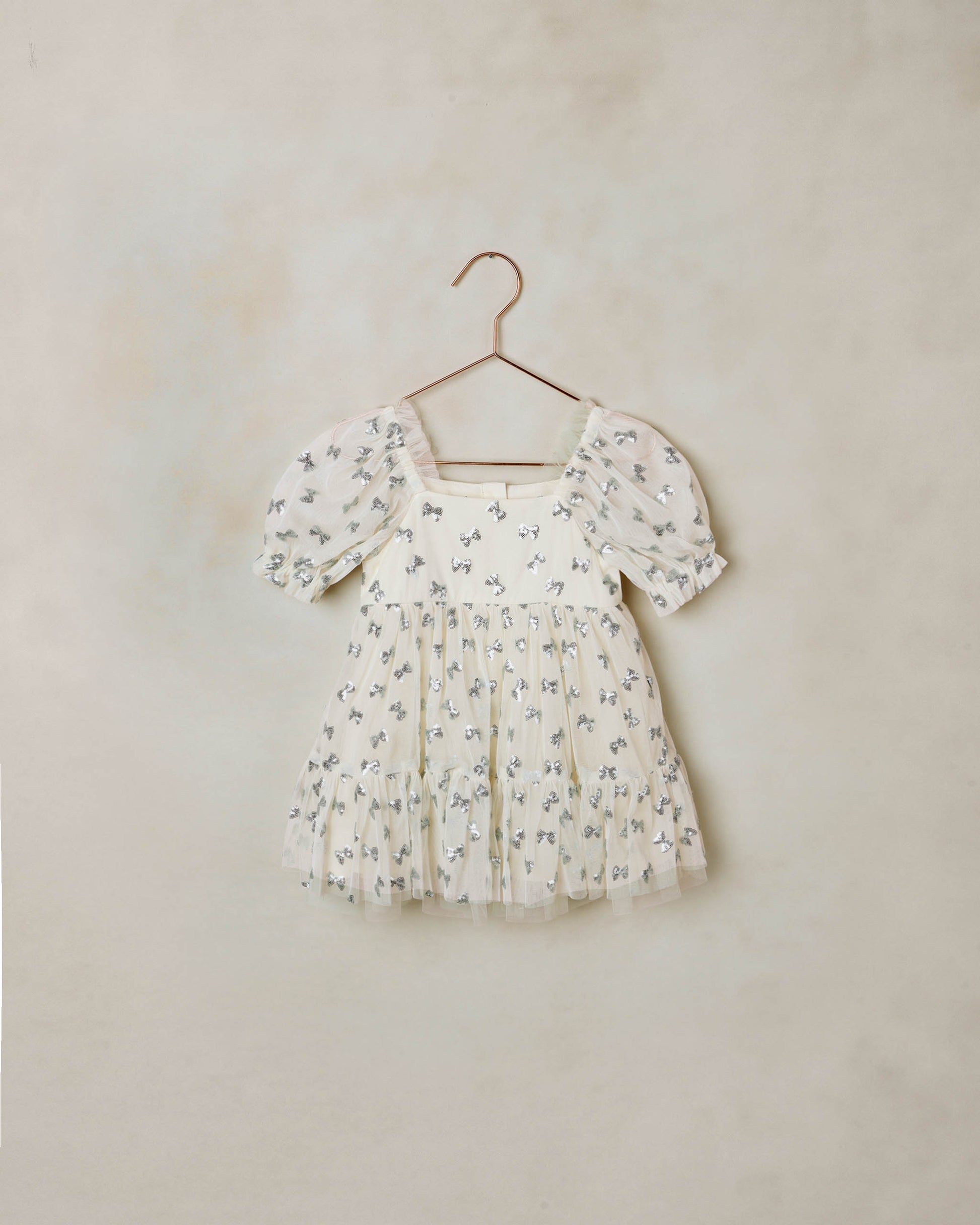 Noralee Bows Louella Dress in natural fabric, featuring a stylish design with bow accents and comfortable fit.