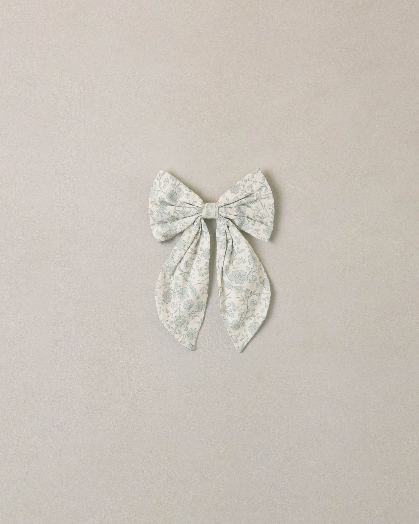 Noralee Sky Floral Everly Bow in ivory, featuring a soft fabric bow with floral pattern, perfect for accessories and hair styling.