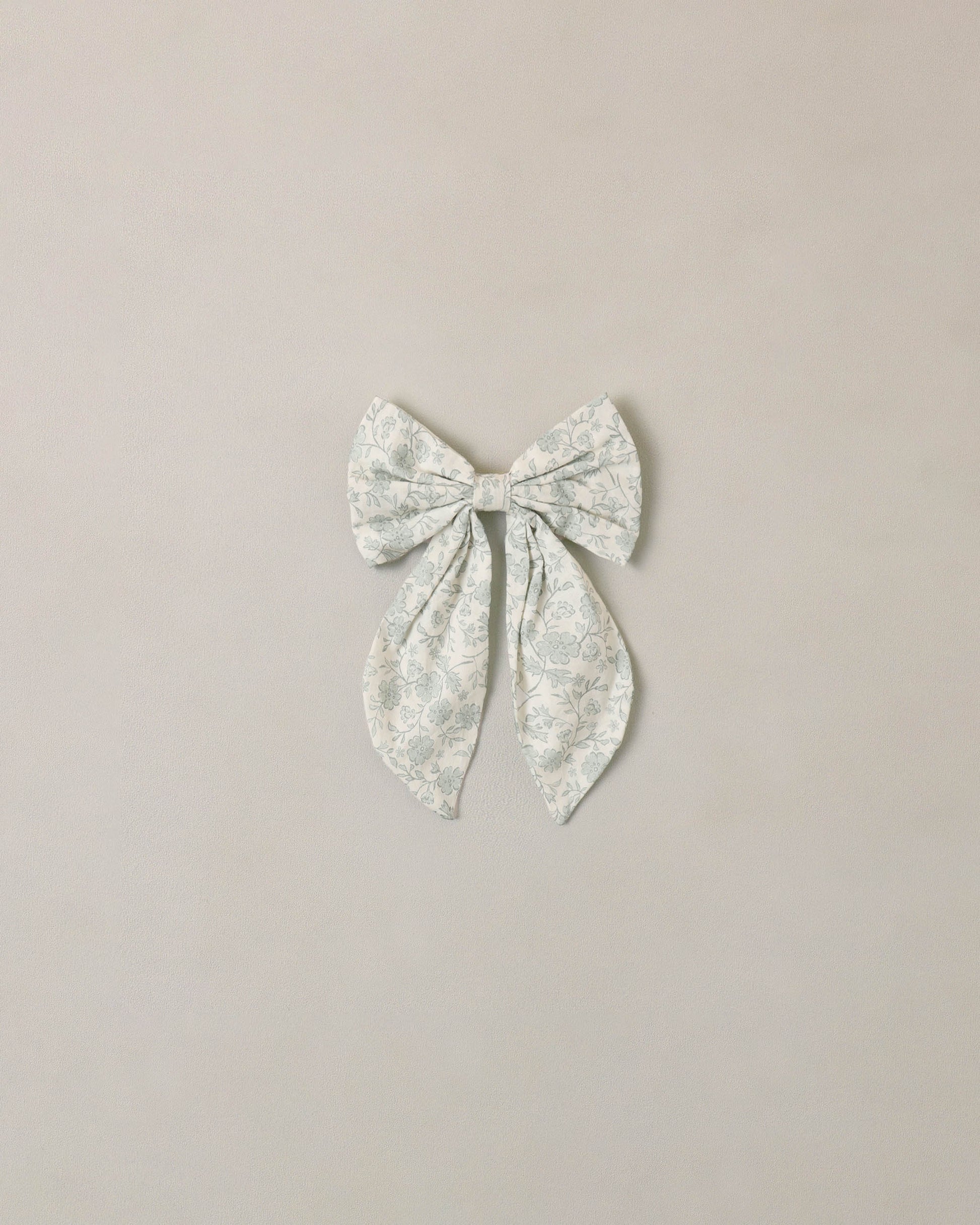 Noralee Sky Floral Everly Bow in ivory, featuring a soft fabric bow with floral pattern, perfect for accessories and hair styling.