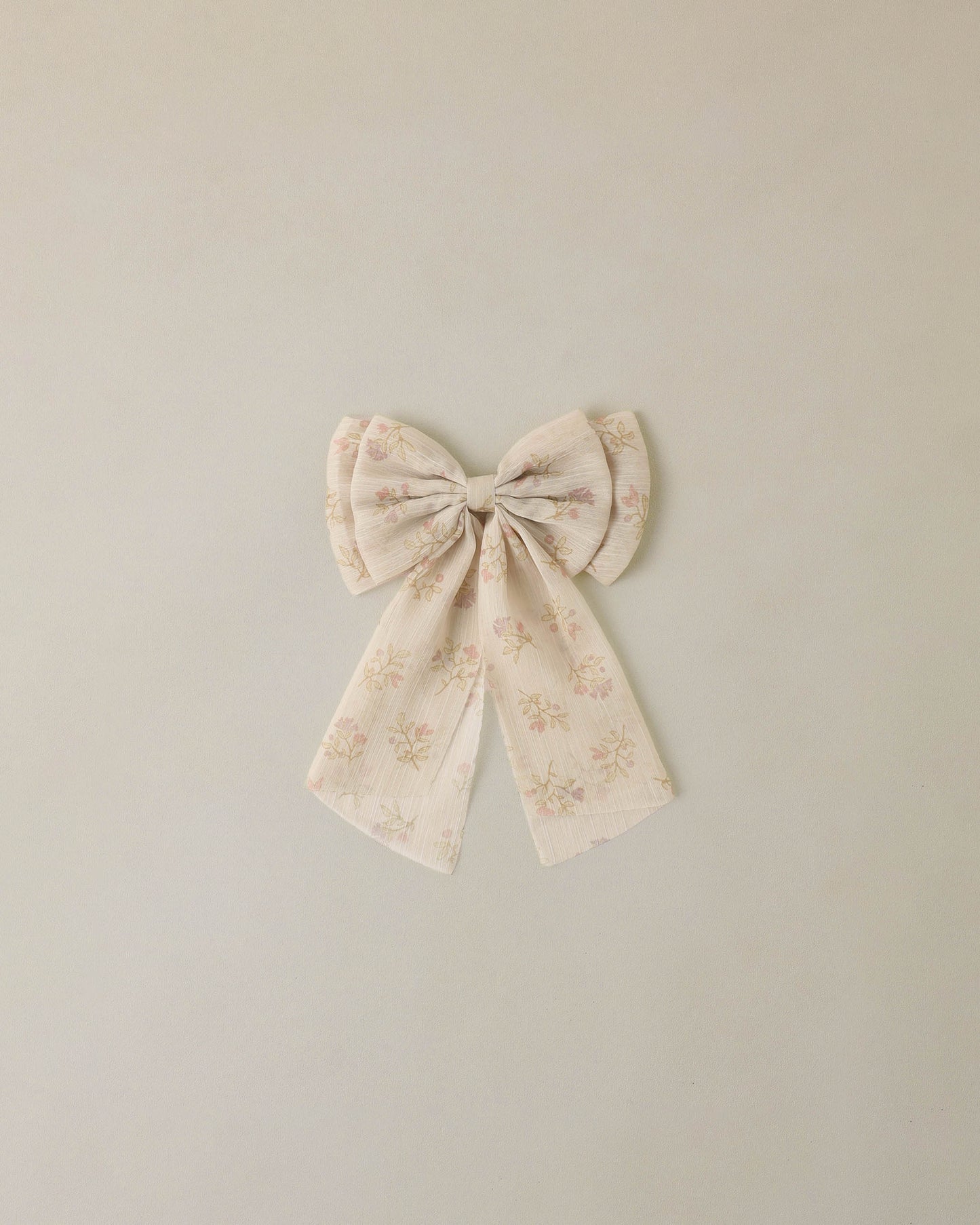 Noralee Posy Alice Bow with pearl accents, soft pastel pink fabric, and elegant design for a charming accessory.