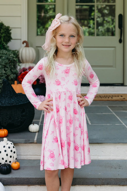 In My Jammers Candy Pail Garden Twirl Dress featuring colorful candy and garden print, perfect for young girls.