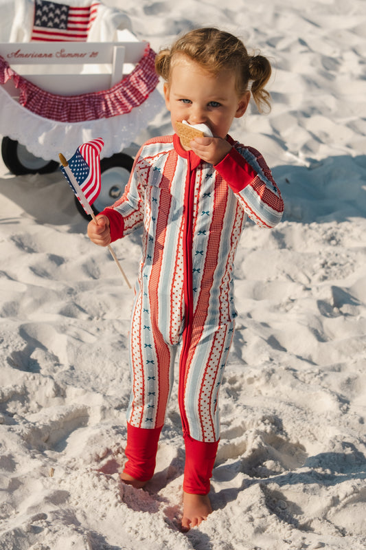 Heritage striped zipper romper by In My Jammers, featuring a colorful striped pattern and front zipper detail.