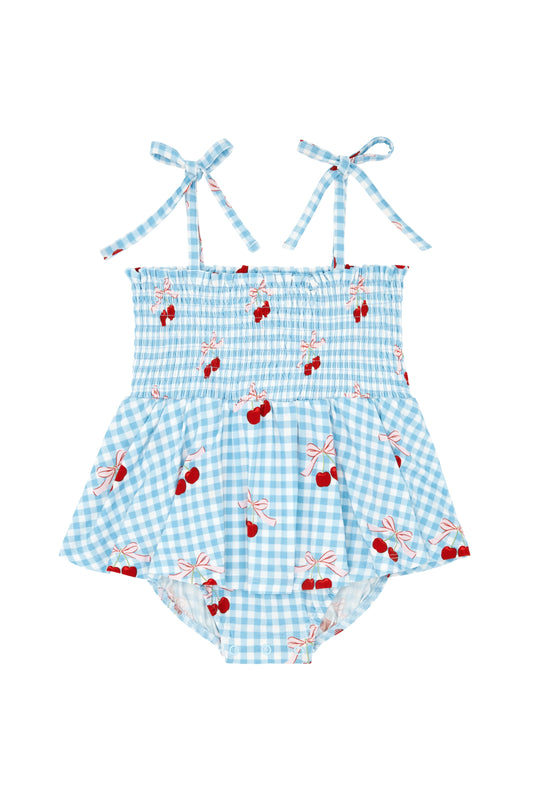 Little Cherry smocked twirl romper for baby girls, featuring colorful cherry print and soft fabric, by In My Jammers.