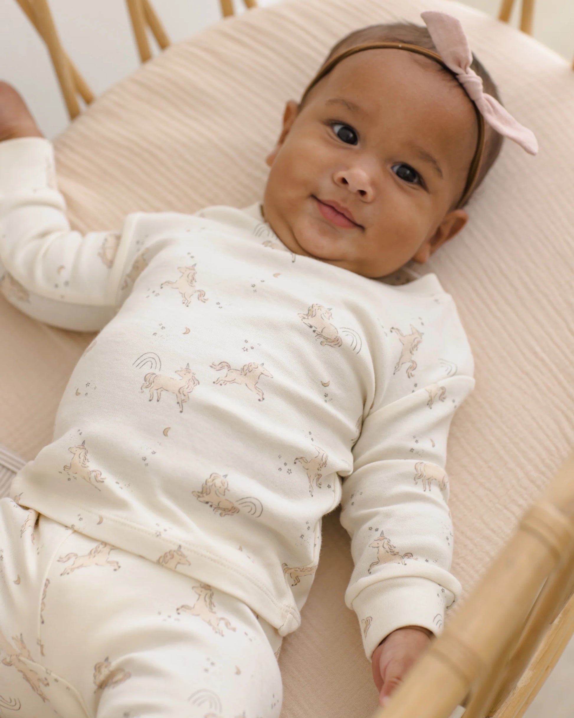 Quincy Mae blush Little Knot Headband featuring a soft fabric knot design, perfect for infants and young children.